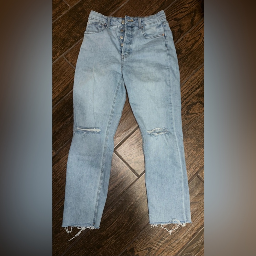 Light wash jeans, two rips on the knee, in great condition, barely worn